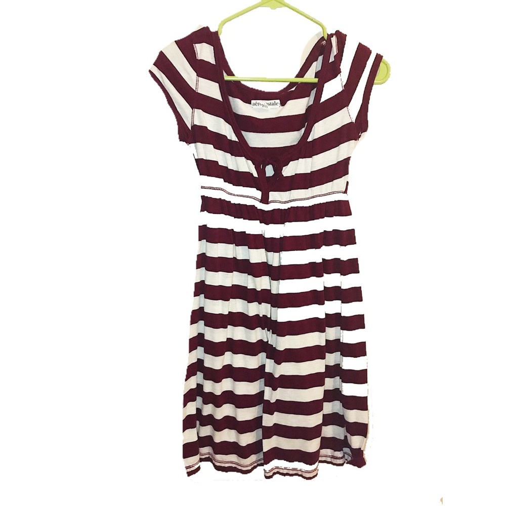 A short maroon-striped dress